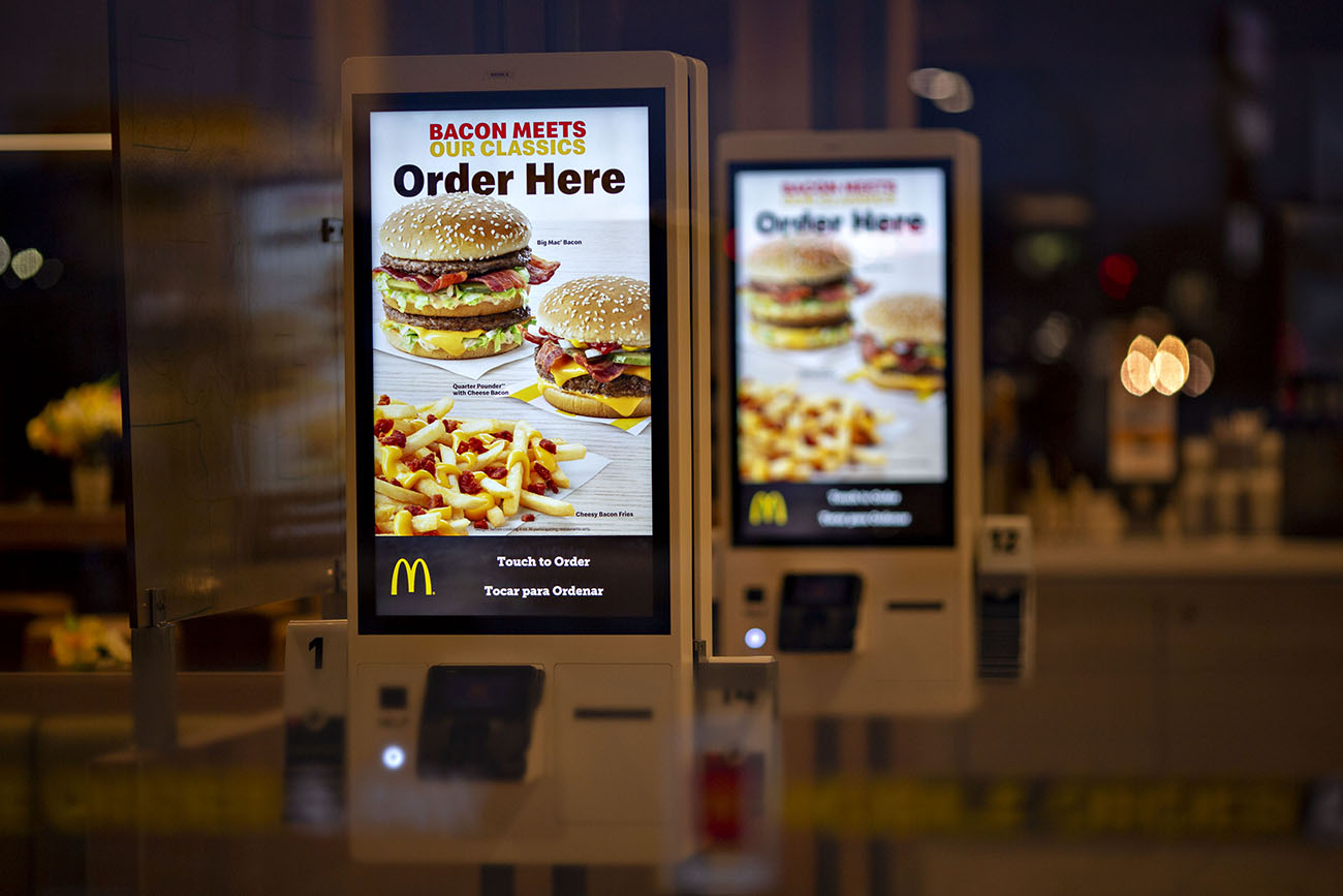 See-order kiosks stand inside a McDonald’s Corp. restaurant in Peru, Illinois, U.S., on Wednesday, March 27, 2019. McDonald’s Corp., in its largest acquisition in 20 years, is buying a decision-logic technology company to better personalize menus in its digital push. Photographer: Daniel Acker/Bloomberg